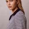 Baumwoll-Polo-Shirt mit konturierten Rippbündchen Baumwoll-Polo-Shirt mit konturierten Rippbündchen
