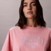 Boxy-T-Shirt mit Bogen-Logo-Grafik Boxy-T-Shirt mit Bogen-Logo-Grafik