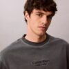 Klassisches T-Shirt mit Rundhalsausschnitt und Logo-Grafik in verwaschener Optik Klassisches T-Shirt mit Rundhalsausschnitt und Logo-Grafik in verwaschener Optik