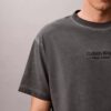 Klassisches T-Shirt mit Rundhalsausschnitt und Logo-Grafik in verwaschener Optik Klassisches T-Shirt mit Rundhalsausschnitt und Logo-Grafik in verwaschener Optik