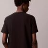 Klassisches T-Shirt mit Schatten-Logo-Grafik Klassisches T-Shirt mit Schatten-Logo-Grafik