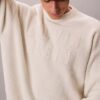 Locker sitzender Pullover mit Varsity-Logo-Grafik
