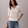 Polo-Shirt aus offenem Strick Polo-Shirt aus offenem Strick