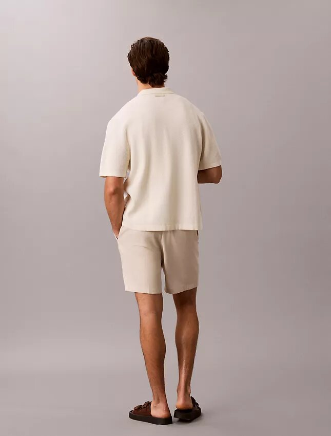 Pullover mit Knopfleiste und Netzstruktur Pullover mit Knopfleiste und Netzstruktur