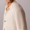 Pullover mit Knopfleiste und Netzstruktur Pullover mit Knopfleiste und Netzstruktur