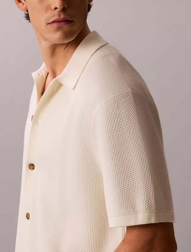 Pullover mit Knopfleiste und Netzstruktur Pullover mit Knopfleiste und Netzstruktur