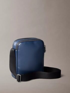 Reporter-Tasche mit geprägtem Monogram-Reißverschlusstasche