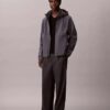 Softshell-Jacke mit Kapuze und Reißverschluss Softshell-Jacke mit Kapuze und Reißverschluss