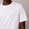 T-Shirt mit durchgehendem Monogram und lockerer Passform T-Shirt mit durchgehendem Monogram und lockerer Passform