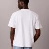 T-Shirt mit durchgehendem Monogram und lockerer Passform T-Shirt mit durchgehendem Monogram und lockerer Passform