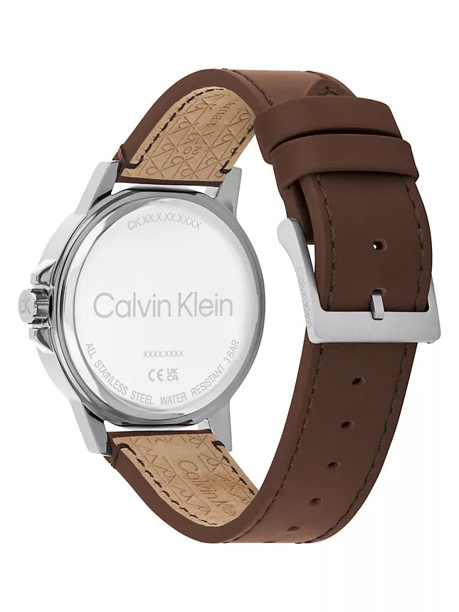 Uhr mit Emblem-Zifferblatt und Lederarmband Uhr mit Emblem-Zifferblatt und Lederarmband